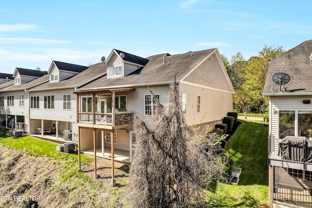 10033 Autumn Valley Ln, Knoxville, TN 37922 - back of house featuring central AC, a patio, and a lawn
