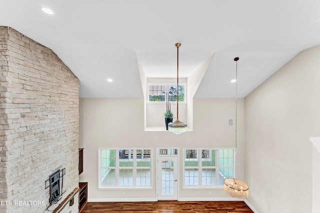 10033 Autumn Valley Ln, Knoxville, TN 37922 - unfurnished living room with baseboards, a stone fireplace, vaulted ceiling, recessed lighting, and wood finished floors