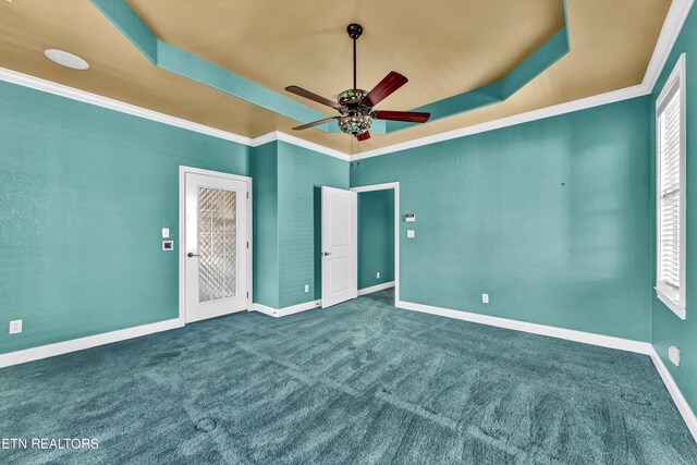 10033 Autumn Valley Ln, Knoxville, TN 37922 - unfurnished bedroom featuring crown molding, baseboards, a raised ceiling, and carpet flooring