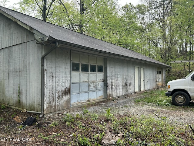 view of property exterior featuring an outdoor structure