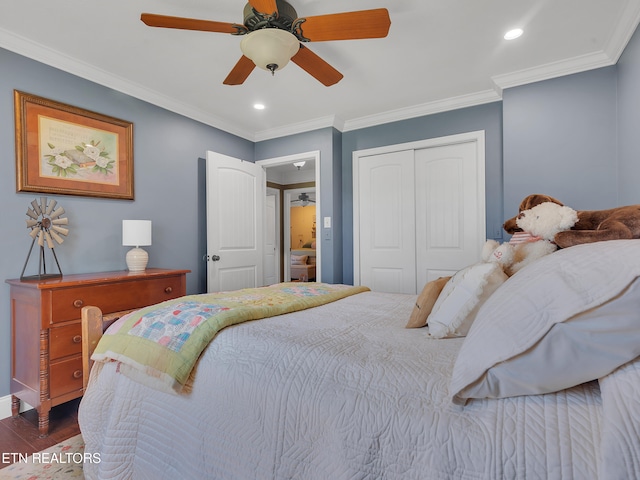 bedroom featuring a closet, crown molding, and wood finished floors