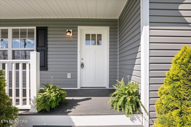 doorway to property with a porch