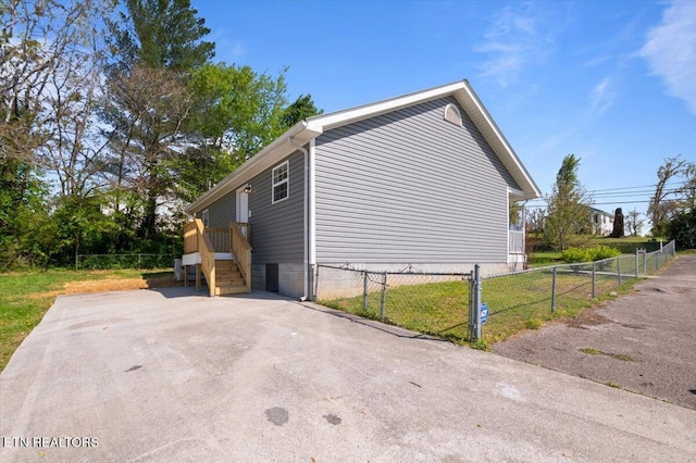 view of side of home with fence