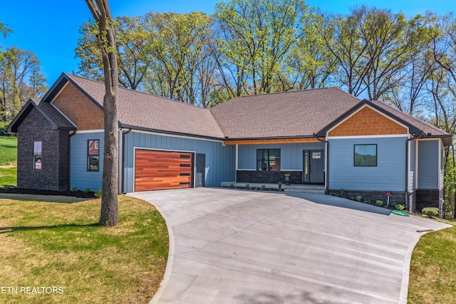 322 Fairway Dr, Dandridge, TN 37725 - craftsman house with concrete driveway, a garage, stone siding, and a front lawn