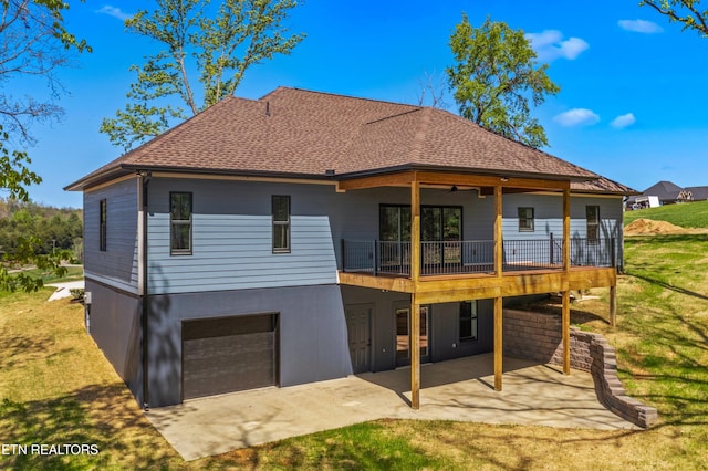 322 Fairway Dr, Dandridge, TN 37725 - back of house featuring a shingled roof, a yard, a garage, a patio, and concrete driveway