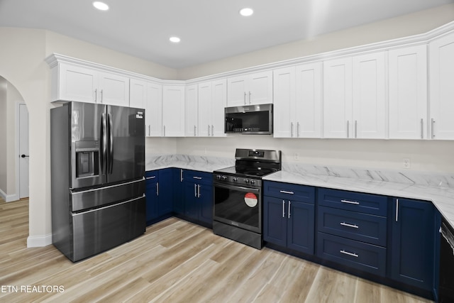322 Fairway Dr, Dandridge, TN 37725 - kitchen featuring arched walkways, white cabinetry, black appliances, light wood finished floors, and blue cabinetry