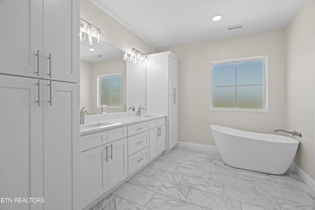 322 Fairway Dr, Dandridge, TN 37725 - bathroom featuring baseboards, marble finish floor, a sink, and a soaking tub