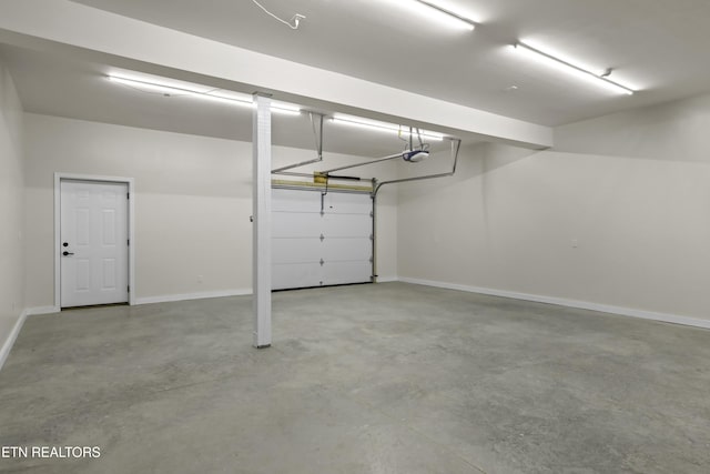 322 Fairway Dr, Dandridge, TN 37725 - garage featuring a garage door opener and baseboards