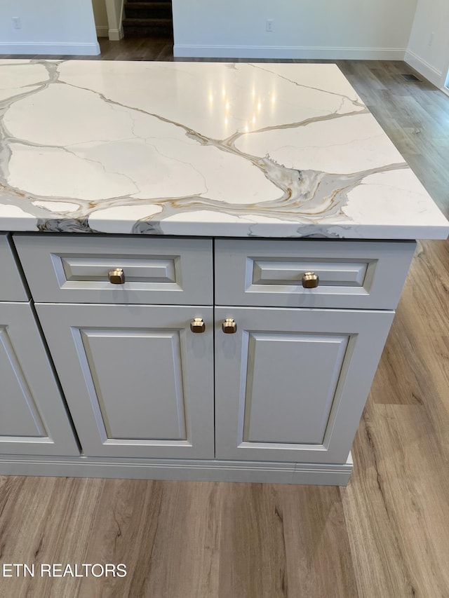 room details featuring wood finished floors and baseboards