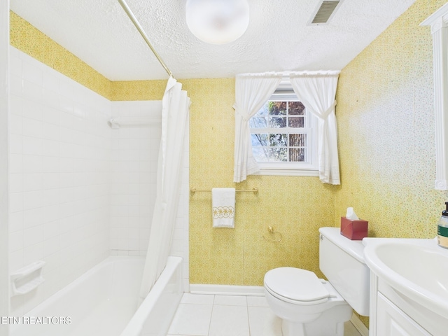 bathroom with vanity, shower / tub combo with curtain, a textured ceiling, toilet, and visible vents