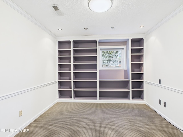 carpeted empty room featuring crown molding, a textured ceiling, visible vents, recessed lighting, and baseboards