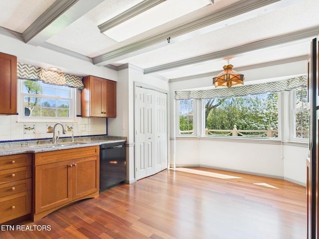 kitchen with beamed ceiling, dark wood-style flooring, a sink, and black dishwasher