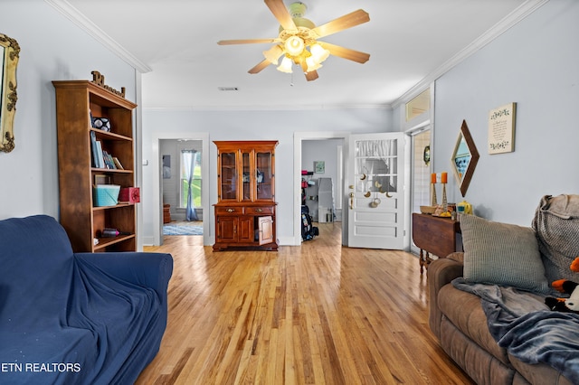 207 Loomis St, Tellico Plains, TN 37385 - living room with light wood-style floors, ceiling fan, crown molding, and baseboards