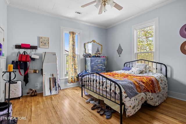 207 Loomis St, Tellico Plains, TN 37385 - bedroom featuring crown molding, wood-type flooring, baseboards, and visible vents