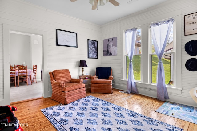 207 Loomis St, Tellico Plains, TN 37385 - living area with ornamental molding, visible vents, ceiling fan, and wood finished floors