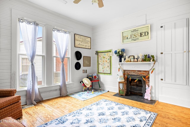 207 Loomis St, Tellico Plains, TN 37385 - interior space with a fireplace, visible vents, a ceiling fan, and wood finished floors