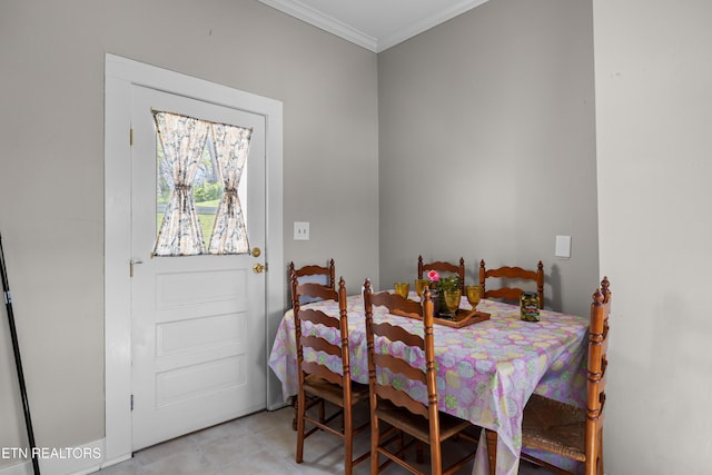 207 Loomis St, Tellico Plains, TN 37385 - dining room with light tile patterned floors and crown molding