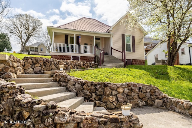 207 Loomis St, Tellico Plains, TN 37385 - view of front of home with stairs, metal roof, and covered porch