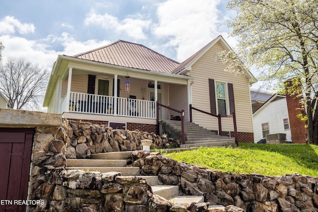 207 Loomis St, Tellico Plains, TN 37385 - view of front facade with a porch, metal roof, and stairs