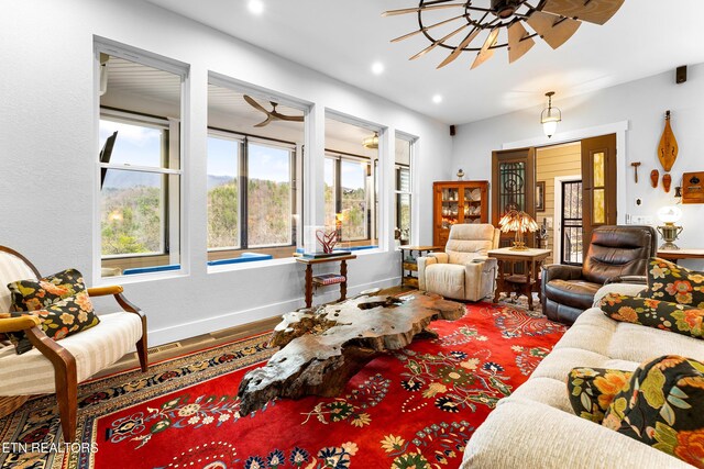 living room featuring baseboards, wood finished floors, recessed lighting, and a ceiling fan