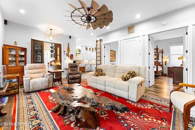 living room with a ceiling fan, wood finished floors, and recessed lighting
