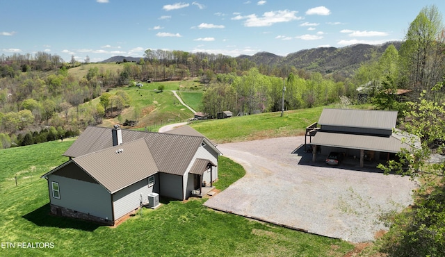 drone / aerial view featuring a mountain view