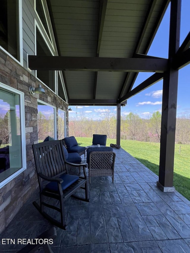 view of patio / terrace with a wooded view