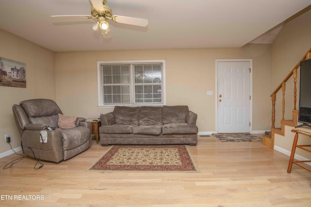 211 Peanut Ln, New Tazewell, TN 37825 - living area with stairs, light wood-style flooring, baseboards, and a ceiling fan