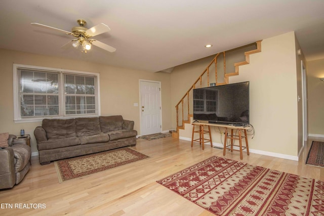 211 Peanut Ln, New Tazewell, TN 37825 - living area with wood finished floors, ceiling fan, baseboards, and stairs