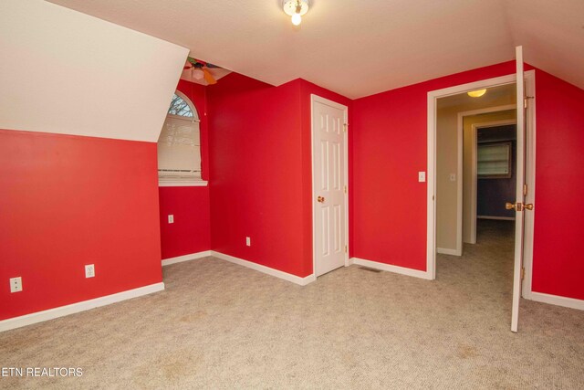 211 Peanut Ln, New Tazewell, TN 37825 - additional living space with baseboards, carpet, and vaulted ceiling