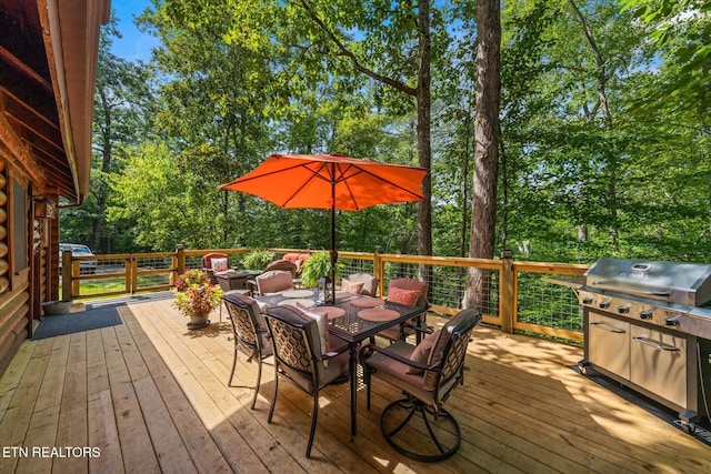 wooden deck featuring outdoor dining area