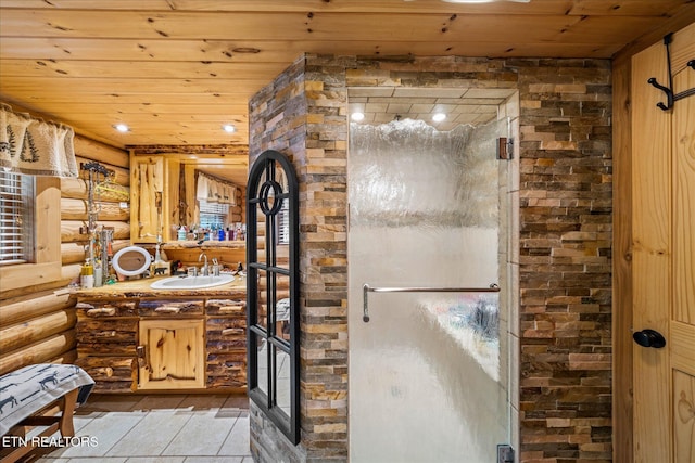 bathroom with a stall shower, vanity, wood ceiling, and rustic walls