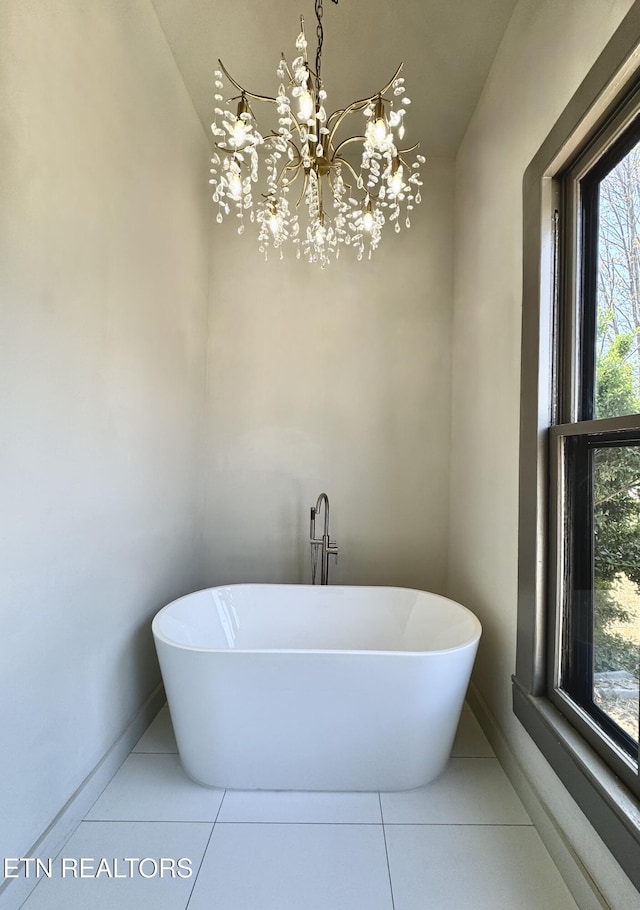 304 Broad St, Sweetwater, TN 37874 - bathroom with a soaking tub, tile patterned flooring, and a wealth of natural light