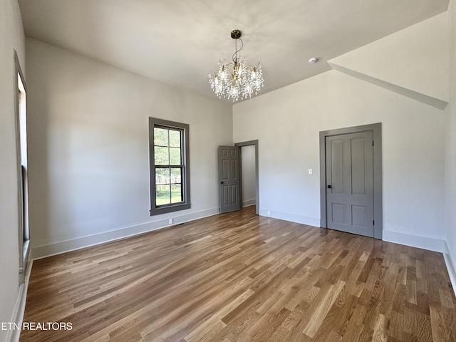 304 Broad St, Sweetwater, TN 37874 - interior space featuring light wood-style flooring, a chandelier, and baseboards