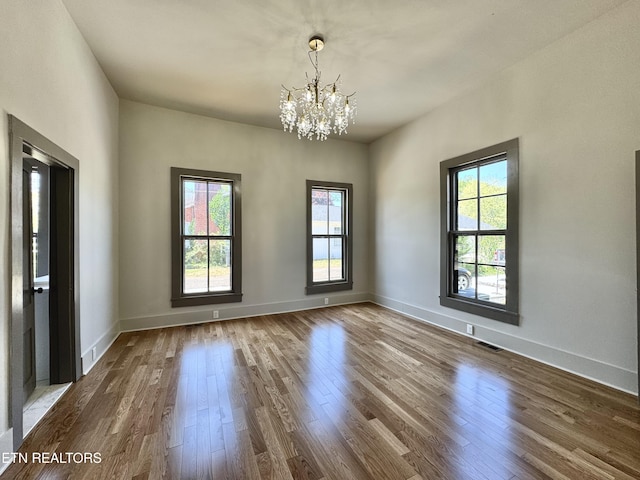 304 Broad St, Sweetwater, TN 37874 - unfurnished dining area featuring a wealth of natural light, a chandelier, baseboards, and dark wood-style floors
