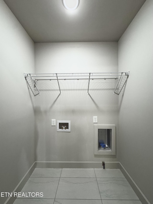 304 Broad St, Sweetwater, TN 37874 - clothes washing area with baseboards, marble finish floor, hookup for a washing machine, and laundry area