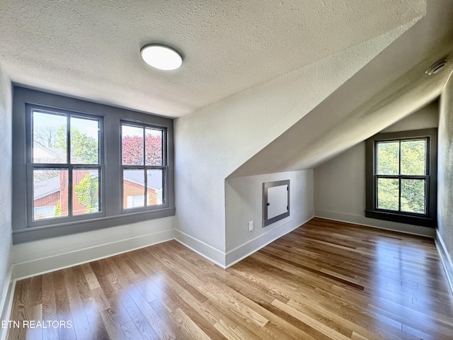 304 Broad St, Sweetwater, TN 37874 - bonus room featuring a textured ceiling, wood finished floors, and baseboards