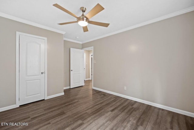unfurnished bedroom featuring crown molding, baseboards, ceiling fan, and wood finished floors