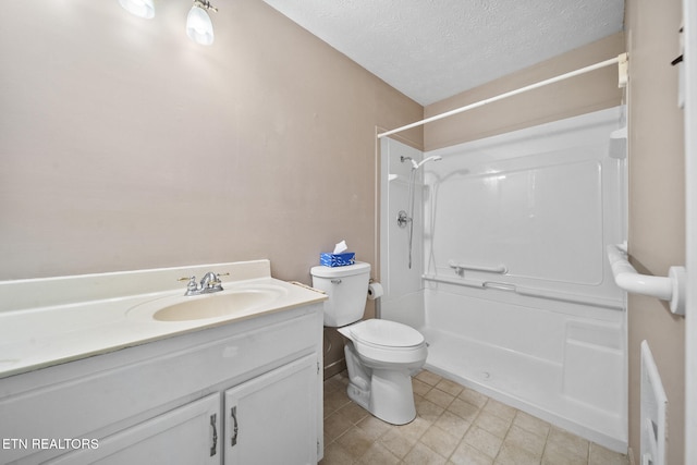 1615 Upper Middle Creek Rd, Sevierville, TN 37876 - bathroom with a shower, vanity, a textured ceiling, and toilet