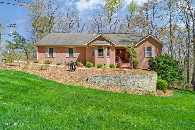 10 Claremont Cir, Fairfield Glade, TN 38558 - single story home with a front lawn and brick siding