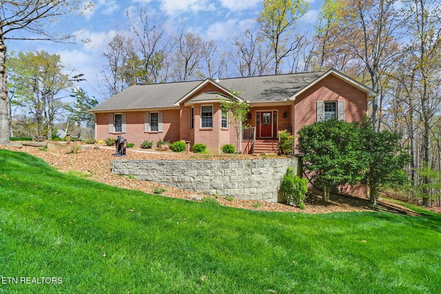 10 Claremont Cir, Fairfield Glade, TN 38558 - ranch-style home with brick siding and a front yard