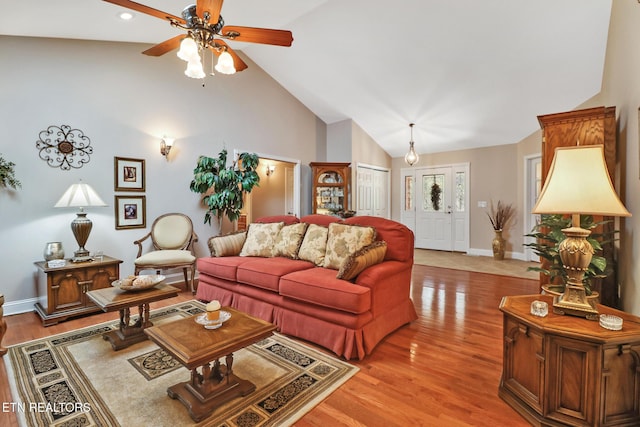 10 Claremont Cir, Fairfield Glade, TN 38558 - living room with high vaulted ceiling, baseboards, a ceiling fan, and light wood finished floors