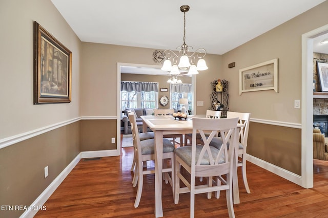 10 Claremont Cir, Fairfield Glade, TN 38558 - dining space with wood finished floors, visible vents, baseboards, and an inviting chandelier