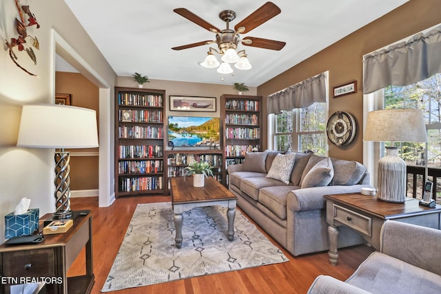 10 Claremont Cir, Fairfield Glade, TN 38558 - living area featuring a wealth of natural light, a ceiling fan, wood finished floors, and baseboards