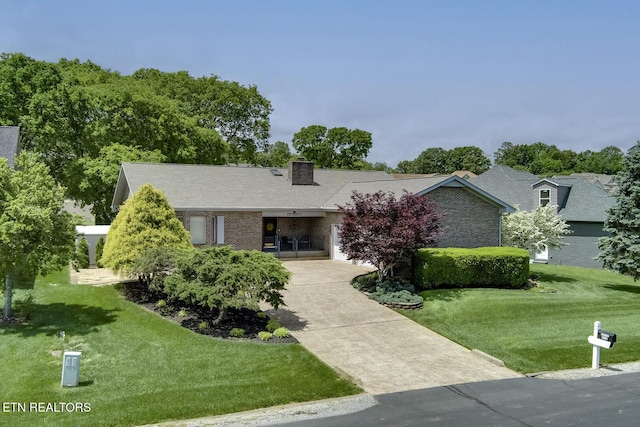 212 Tooweka Ln, Loudon, TN 37774 - single story home featuring a front lawn and a chimney