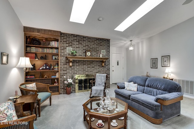 212 Tooweka Ln, Loudon, TN 37774 - living area featuring a skylight, carpet floors, a brick fireplace, and built in shelves