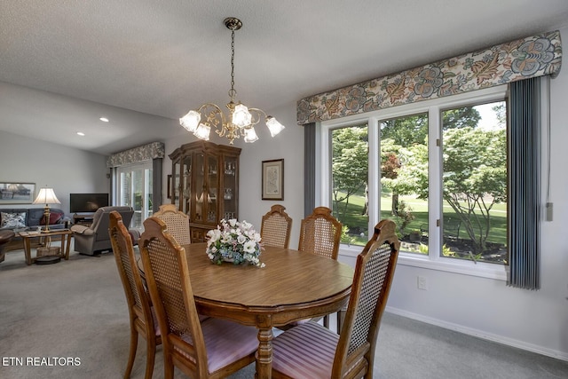 212 Tooweka Ln, Loudon, TN 37774 - carpeted dining area featuring a chandelier and baseboards