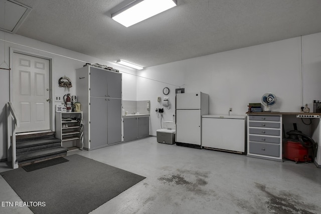 212 Tooweka Ln, Loudon, TN 37774 - garage featuring freestanding refrigerator and refrigerator