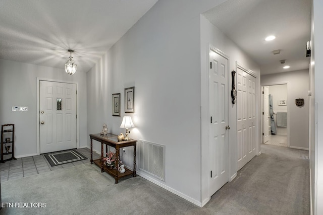 212 Tooweka Ln, Loudon, TN 37774 - carpeted entrance foyer with baseboards, recessed lighting, a chandelier, and tile patterned floors