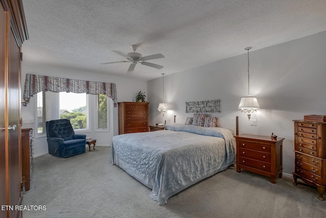 212 Tooweka Ln, Loudon, TN 37774 - carpeted bedroom featuring a textured ceiling, a ceiling fan, and baseboards